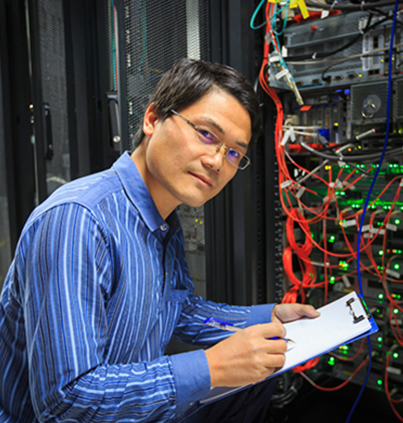 IT Consultant Inspecting Network Cabling